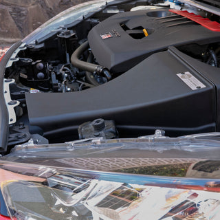 GR Yaris engine bay with open hood, shows PIRAS Motorsport Airbox installed, zoomed view