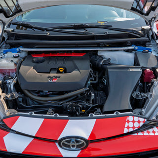 GR Yaris engine bay with open hood, shows PIRAS Motorsport Airbox installed, front top view